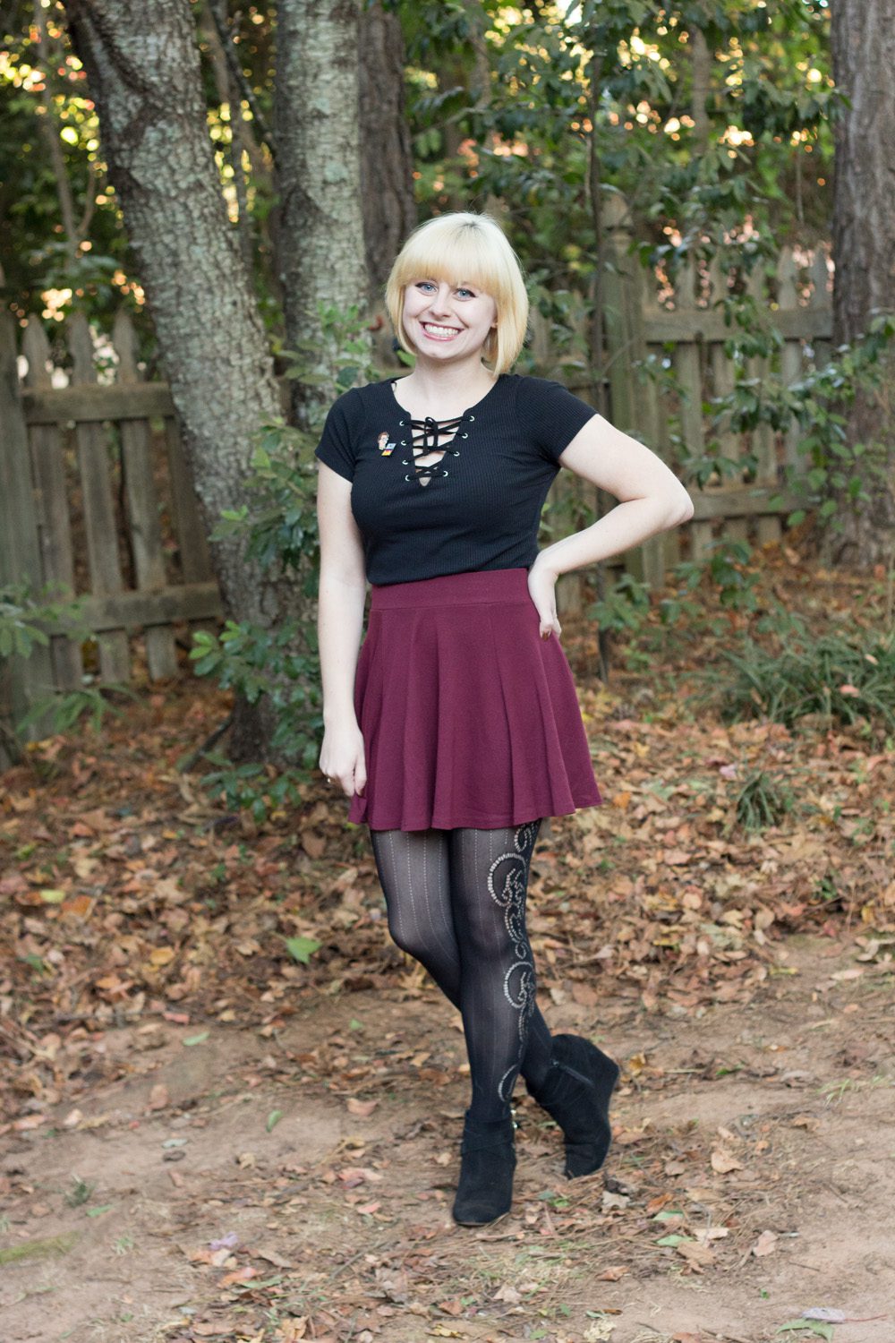 Black lace pantyhose and burgundy skirt worn by Jamie