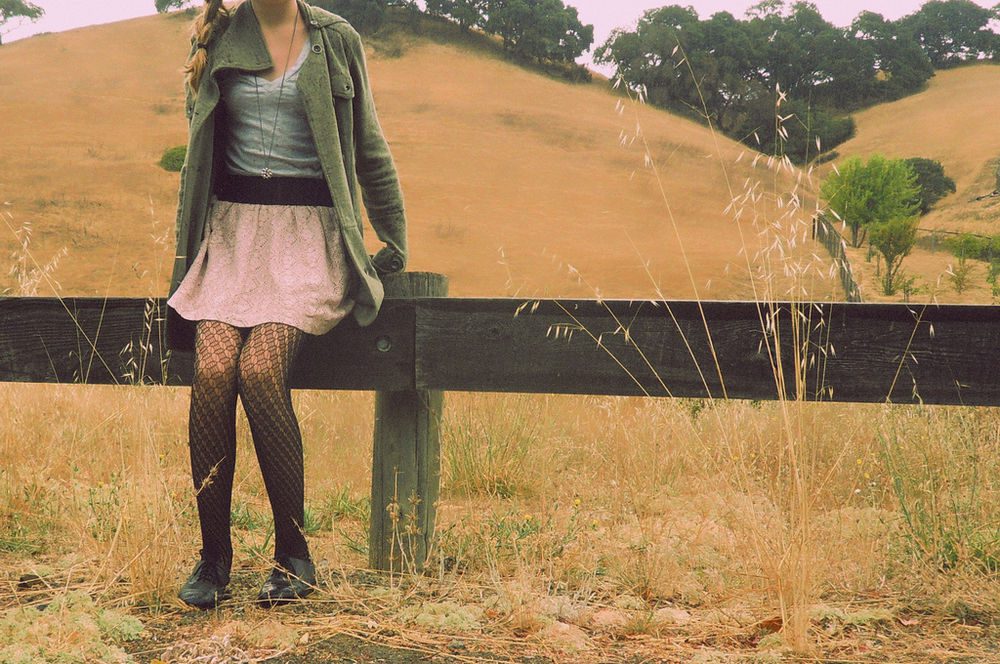 Diamond pattern lace tights with pink skirt and green coat