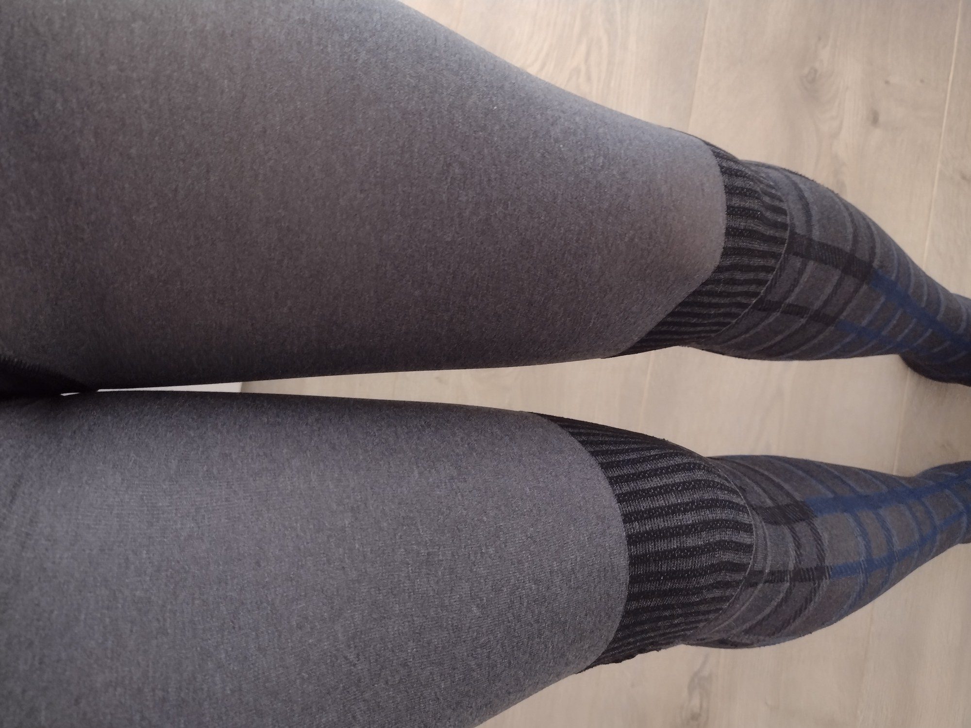 Windowpane check faux-stocking tights worn, showing the thigh transition band