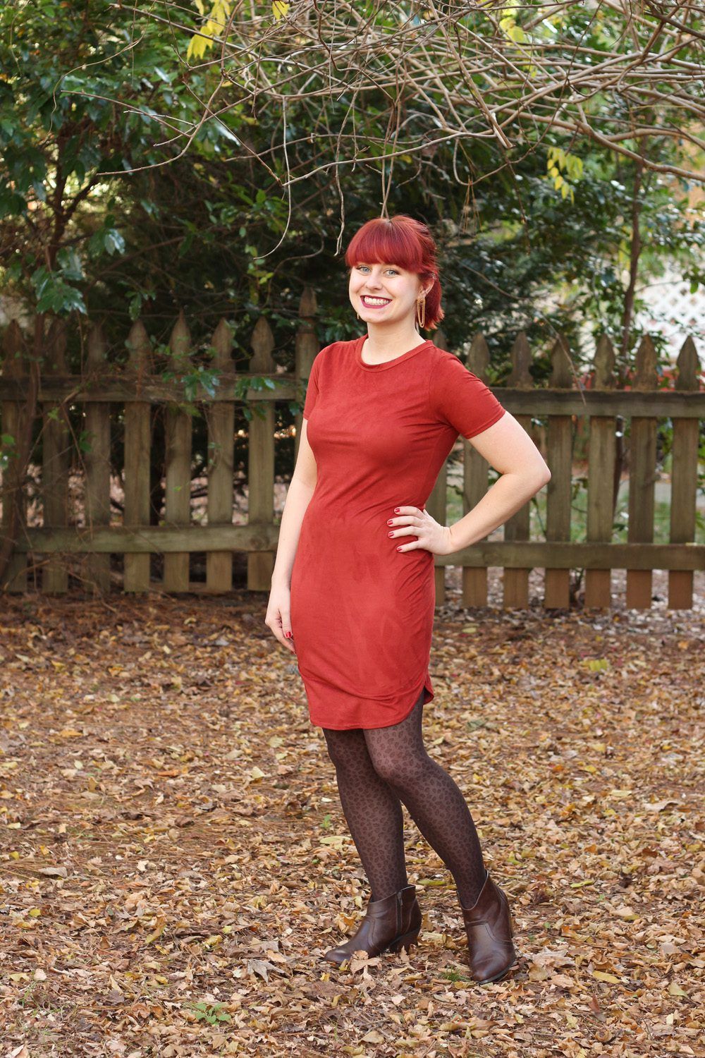 Brown animal pattern pantyhose and brick colored dress worn by Jamie