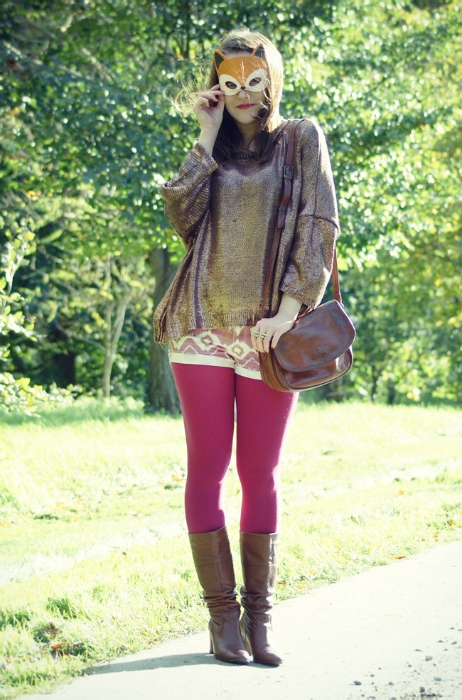 Fuchsia tights with tall dark brown leather boots, a printed tunic and a brown leather shoulder bag