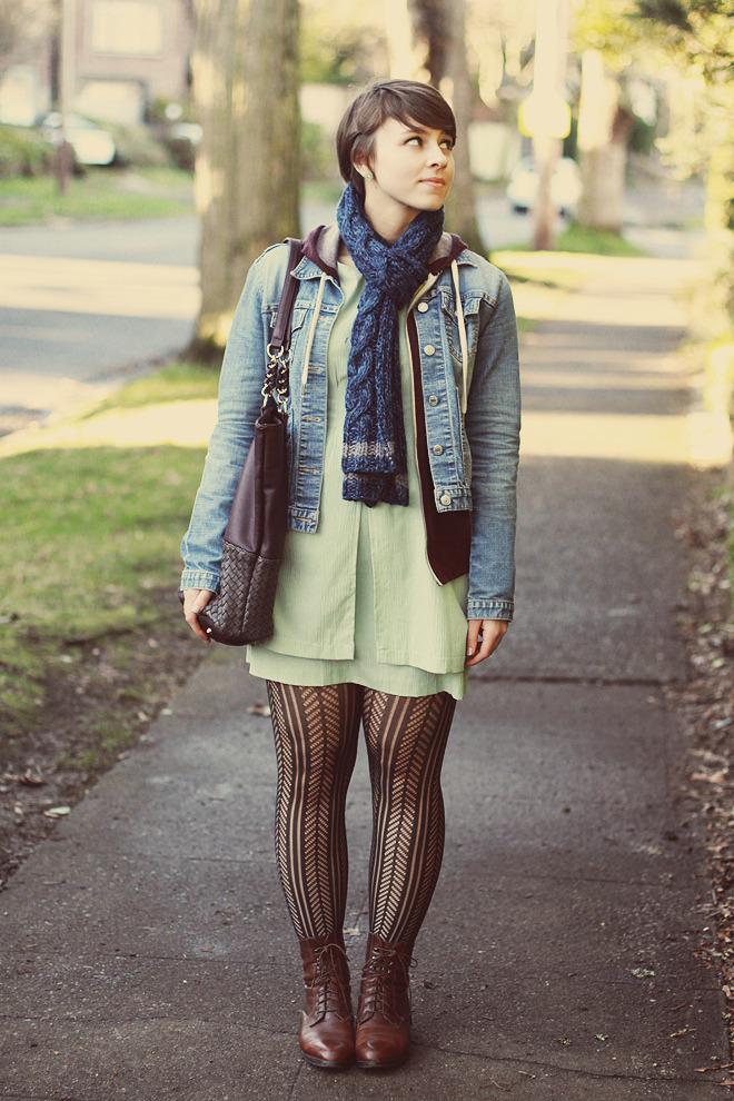 Dark patterned tights with dark brown leather lace-up ankle boots, a mint dress, a denim jacket and a blue scarf