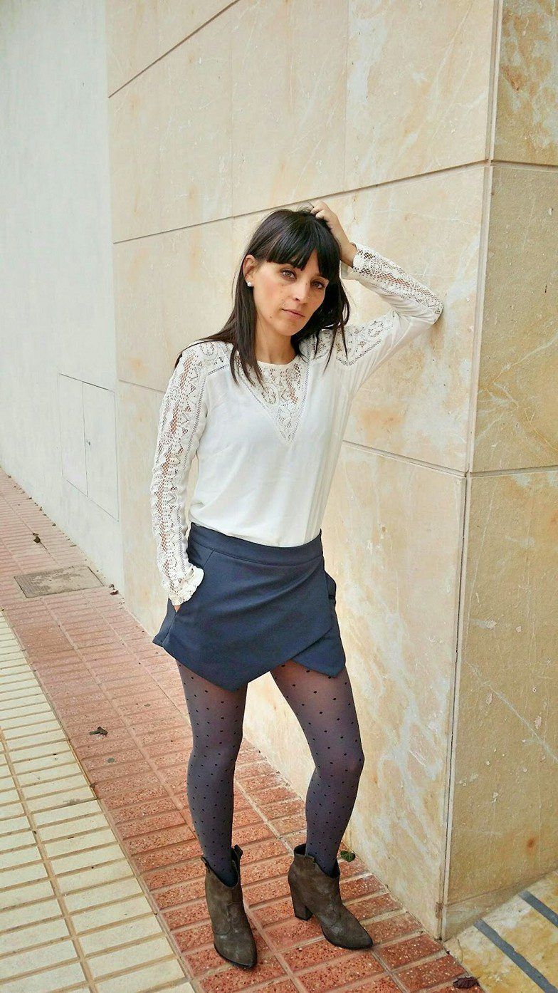 Asymmetrical blue skirt and grey Calzedonia tights worn by Veronica
