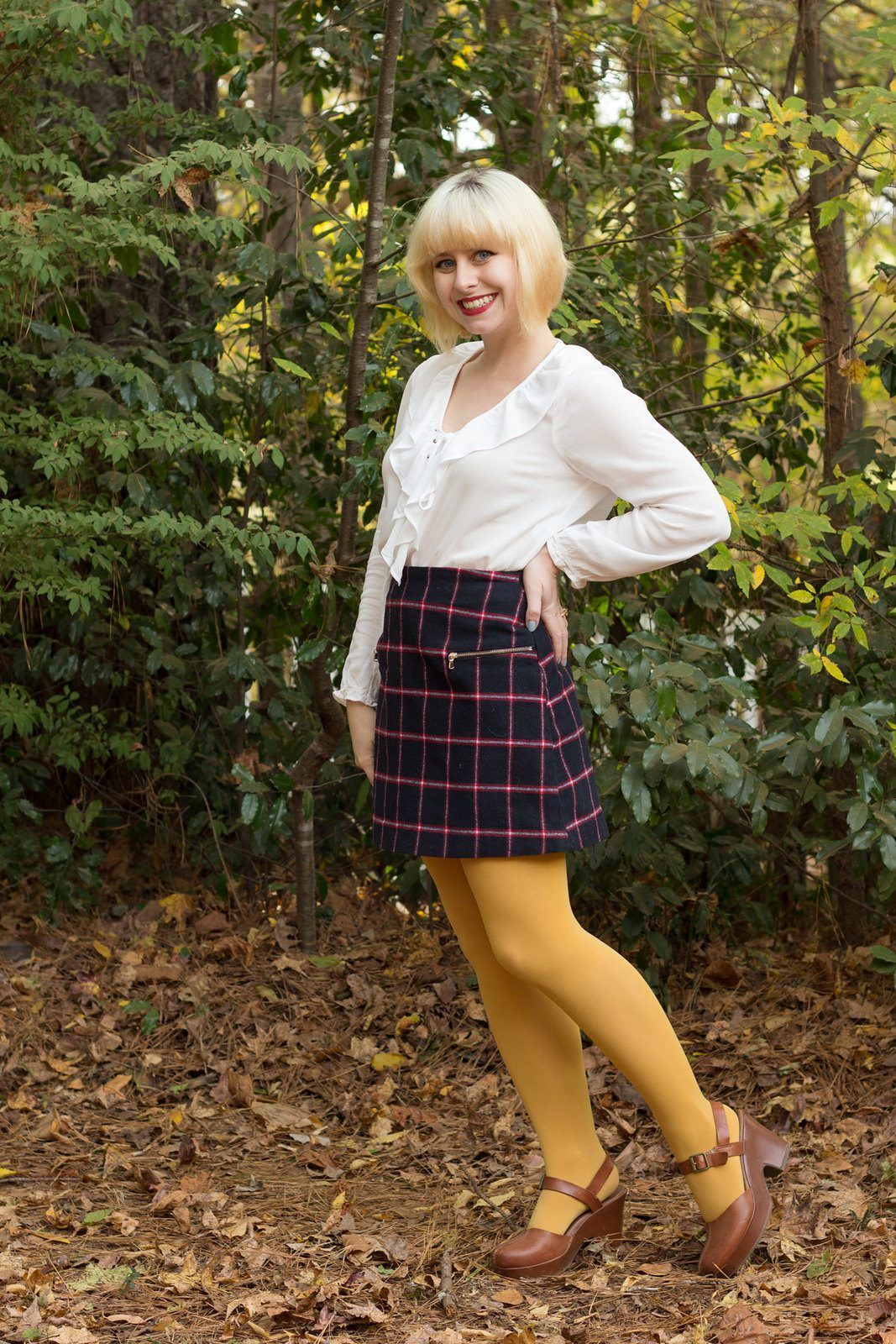 Yellow opaque tights and geometric pattern skirt worn by Jamie