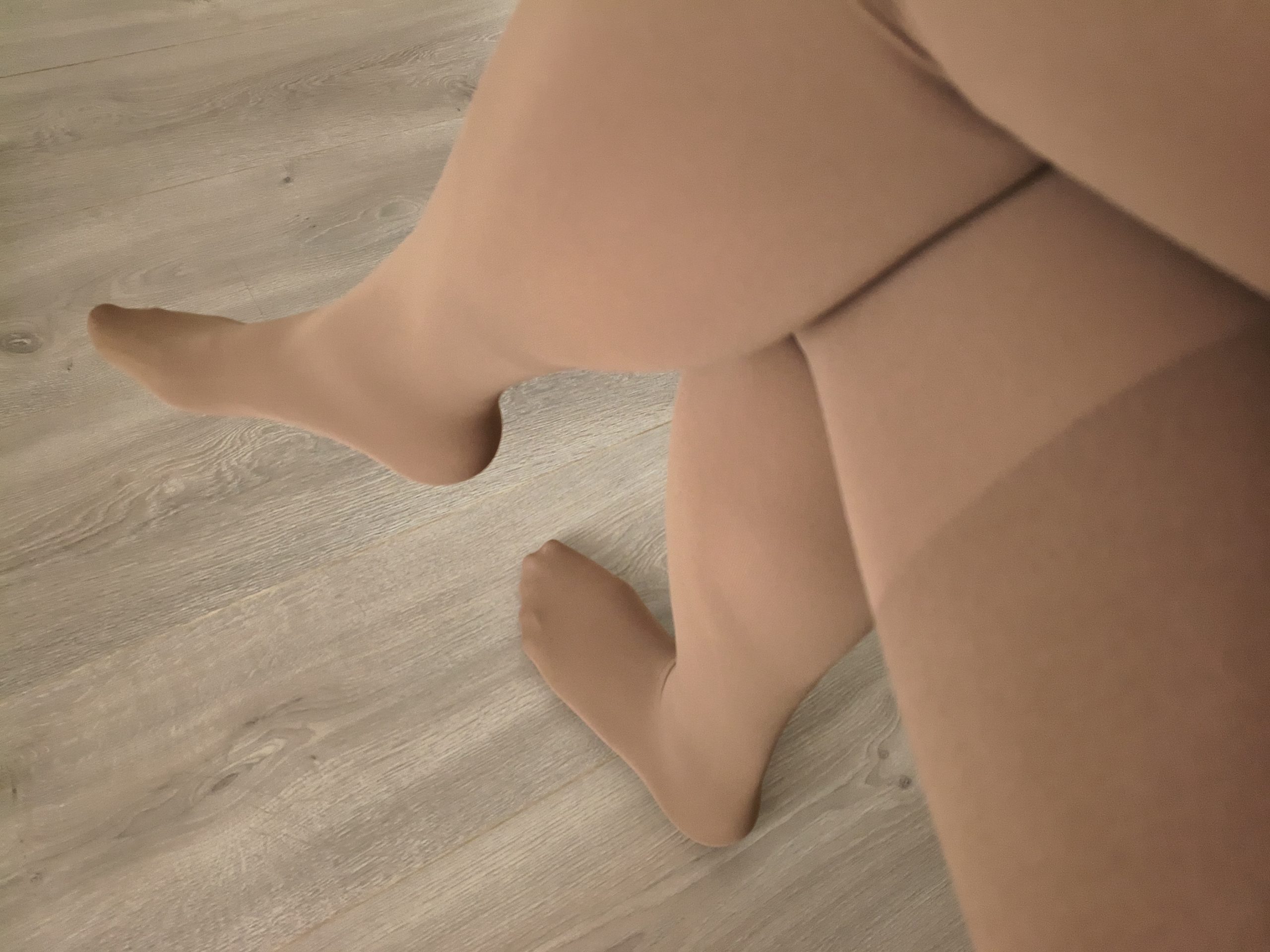 Yirane 80D opaque tights in burgundy, folded flat on a wooden floor