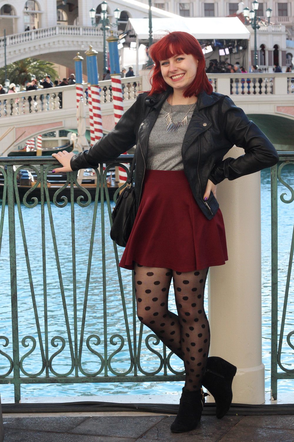 Black sheer polka dot pantyhose and burgundy skirt worn by Jamie