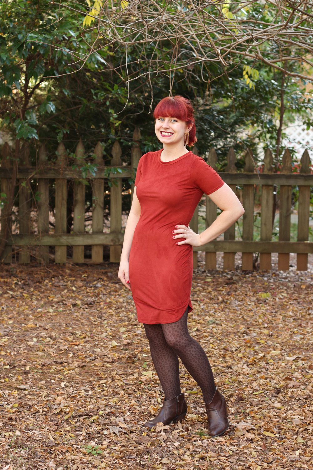 Brown animal pattern pantyhose and brick colored dress worn by Jamie