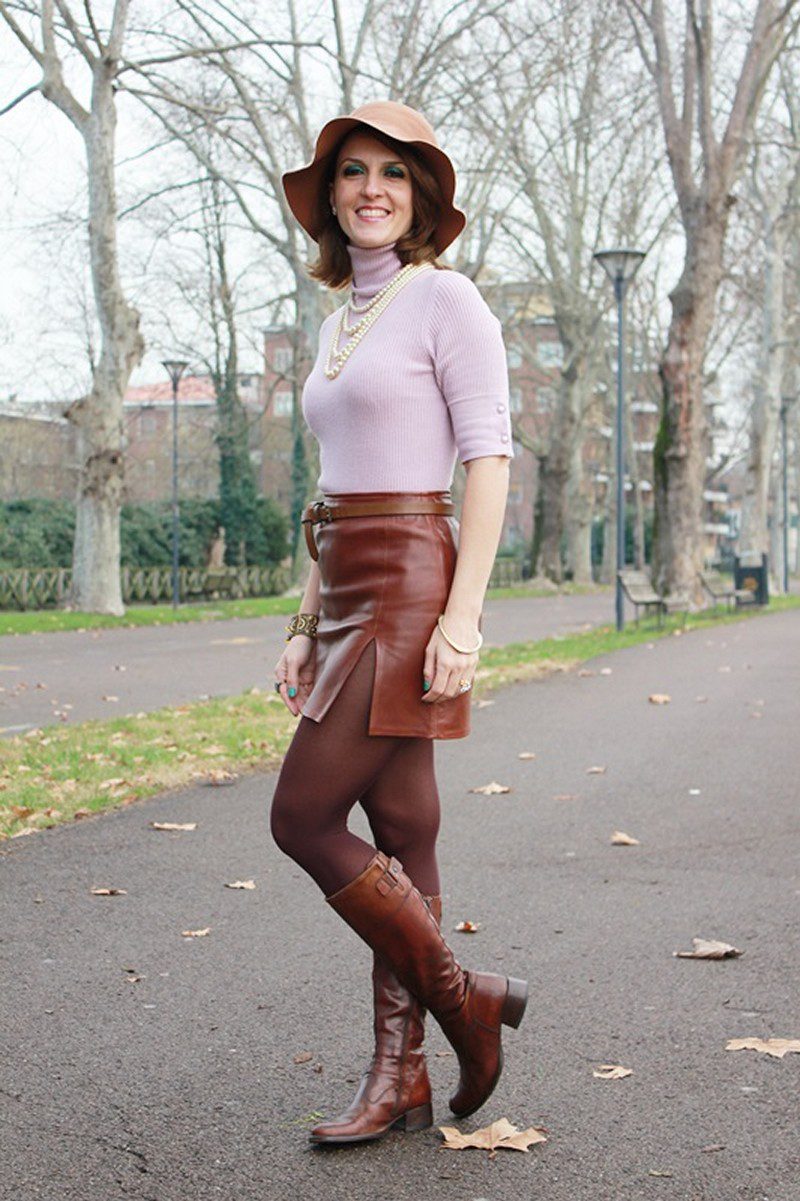 Dark brown tights, leather boots and skirt and pink turtleneck top worn by Margaret