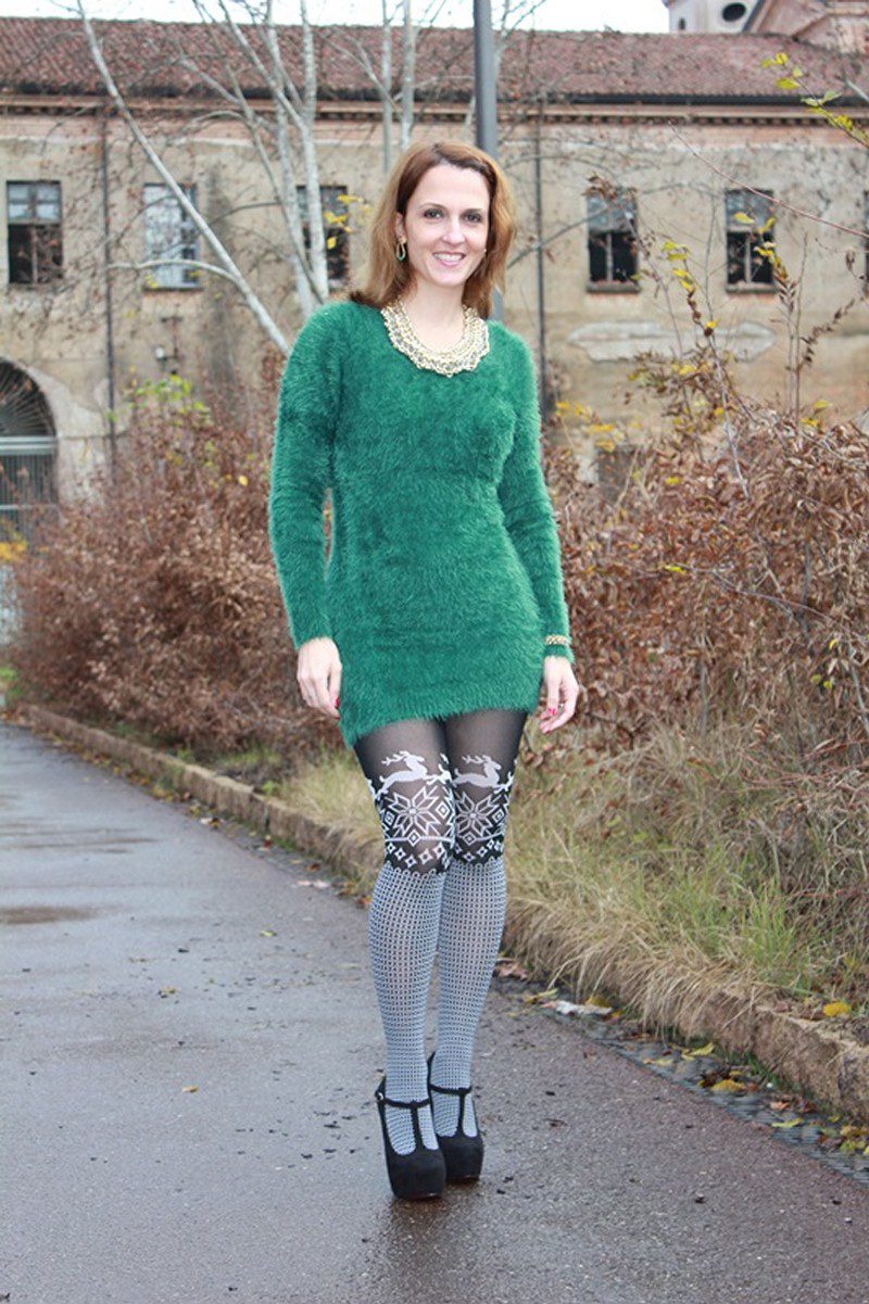Green fur dress and Christmas print black & white tights worn by Margaret