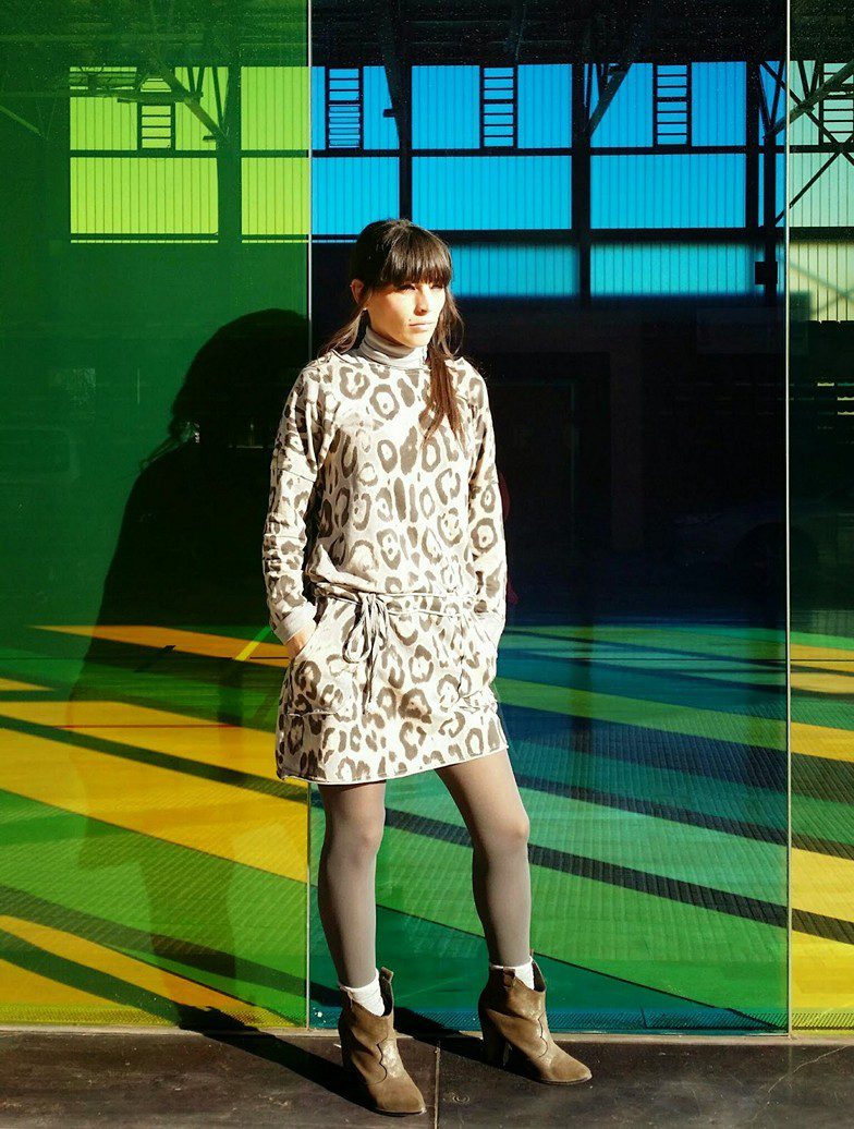 Grey pantyhose, animal print beige dress, white socks and brown boots worn by Veronica