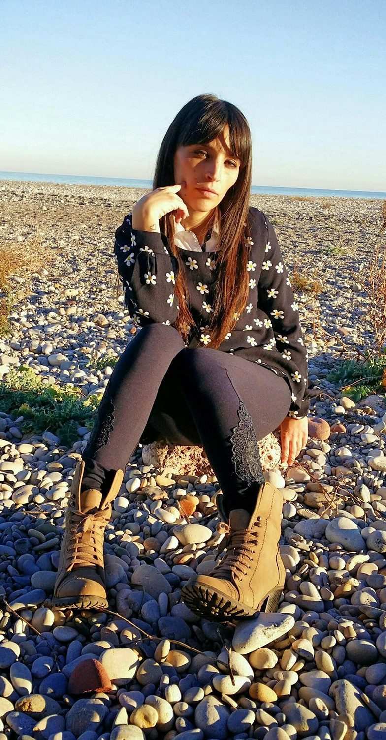 Black embroidered leggings and flower patterned black dress worn by Veronica