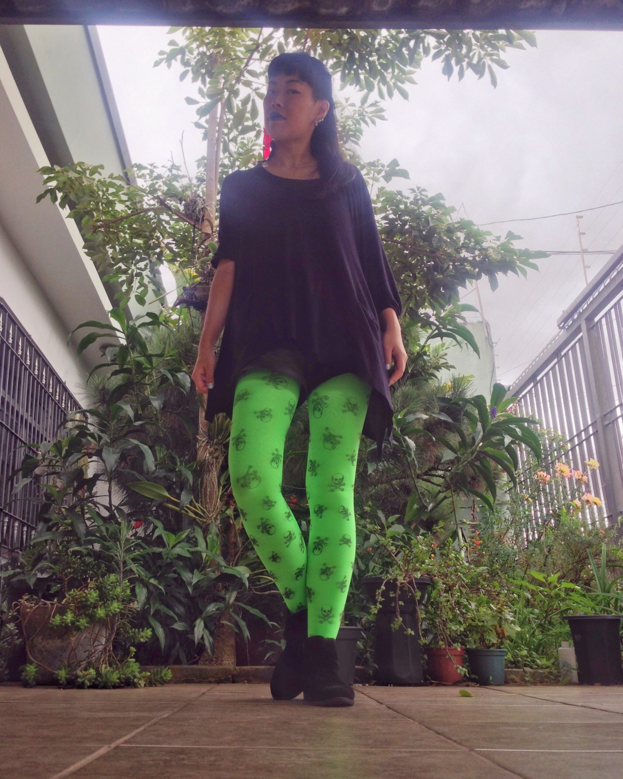 Neon green pantyhose worn by Isis Tomie