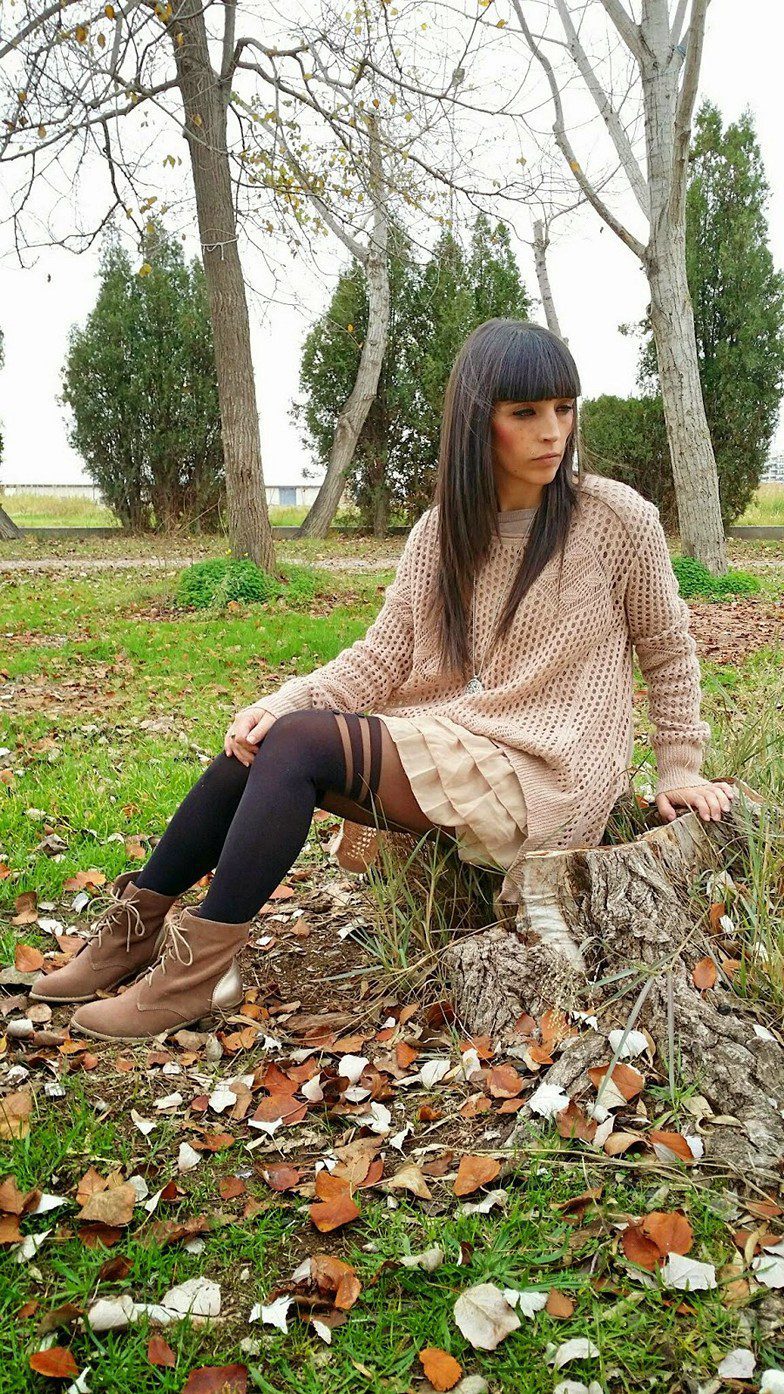 Faux suspender tights, pleated beige skirt and crochet tunic worn by Veronica