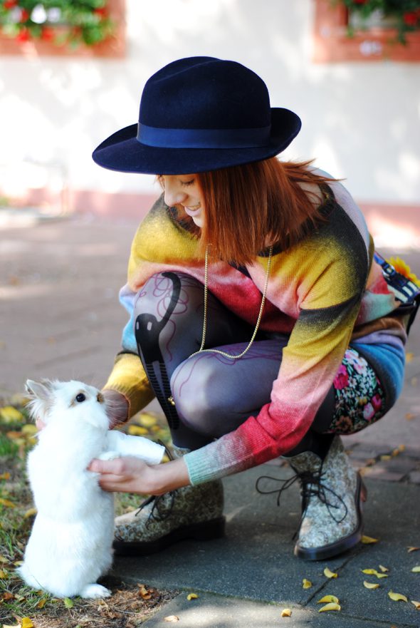 Purple toned hold me tights with flower print skirt and multicolored gradient sweater worn by Monika Krawczyk