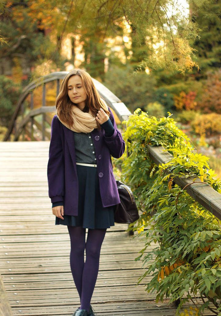 Purple tights and jacket with pleated dark blue skirt and beige snood worn by Wioletta