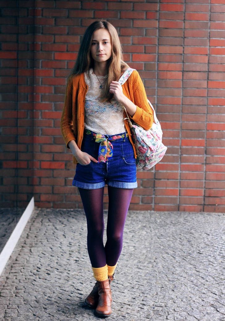 Yellow ankle socks over purple pantyhose, denim shorts, white lace blouse and orange cardigan worn by Wioletta