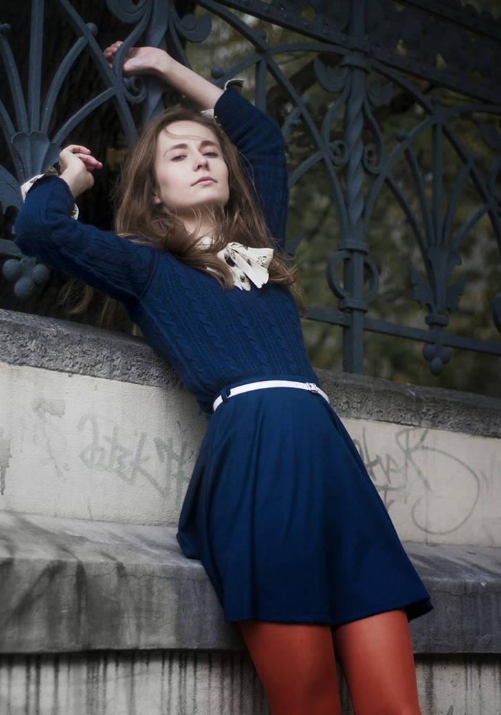 Sheer red tights with blue skirt and wool cardigan worn by Wioletta