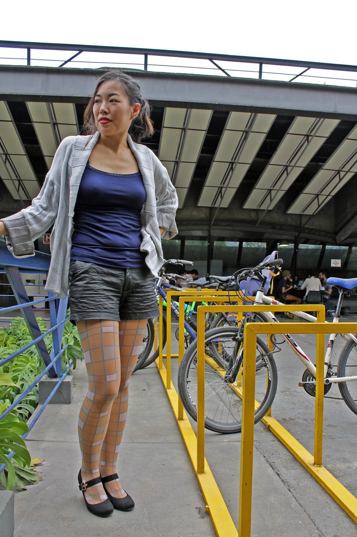 Square patterned pastel pantyhose being worn by Isis Tomie