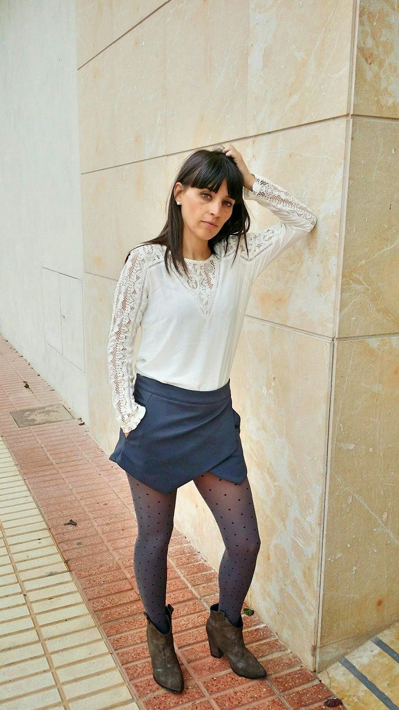Asymmetrical blue skirt and grey Calzedonia tights worn by Veronica
