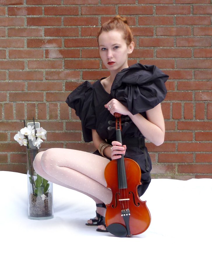 White dotted tights and black dress worn by Saskia van Rij