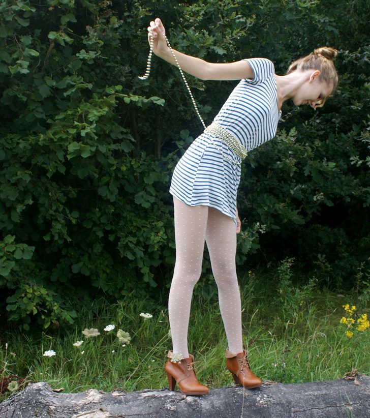 White tights, brown shoes and striped dress worn by Saskia van Rij