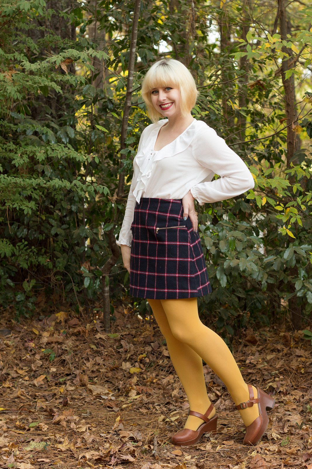 Yellow opaque tights and geometric pattern skirt worn by Jamie